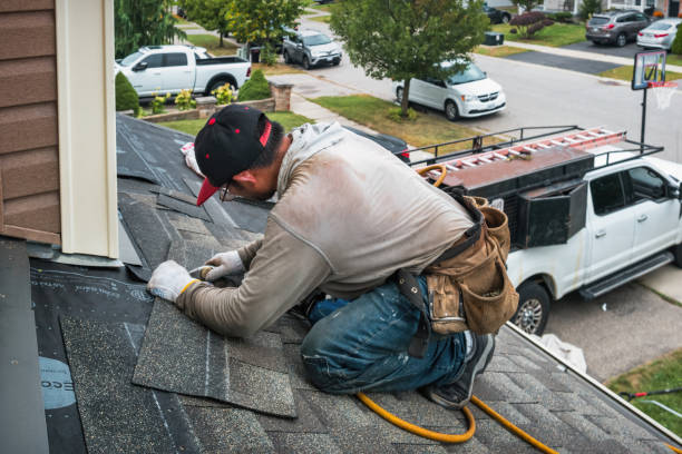 Professional Hail Damage Roof Repair technician working in Key Biscayne, FL